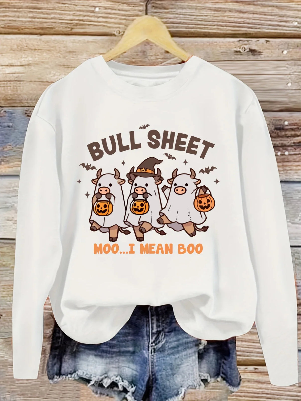 Women's Casual Long Sleeve Crew Neck T-Shirt Halloween Cows With Pumpkins.