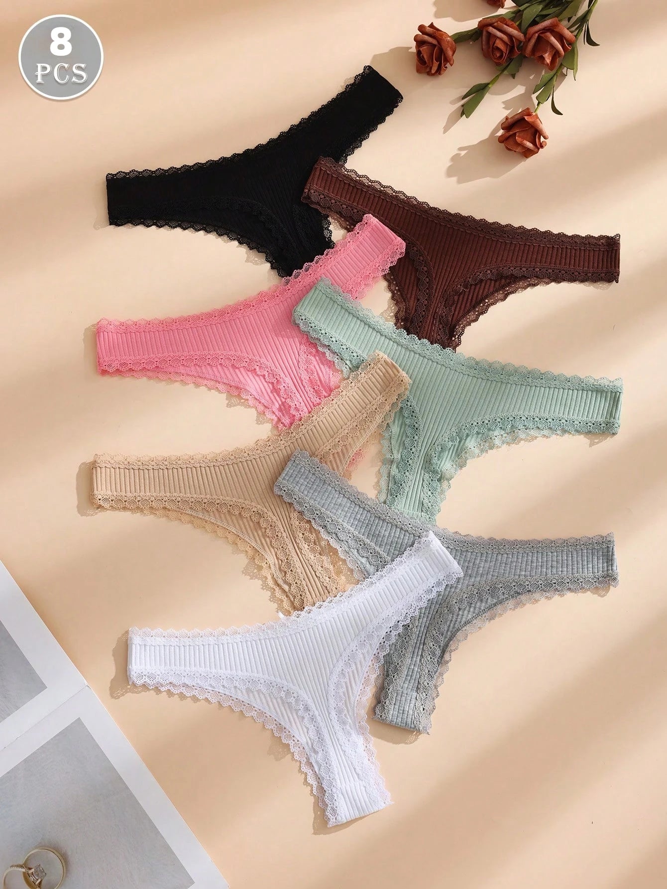 Random color 8-piece set of women's solid thin lace-trimmed thong panties, with cute little bows.