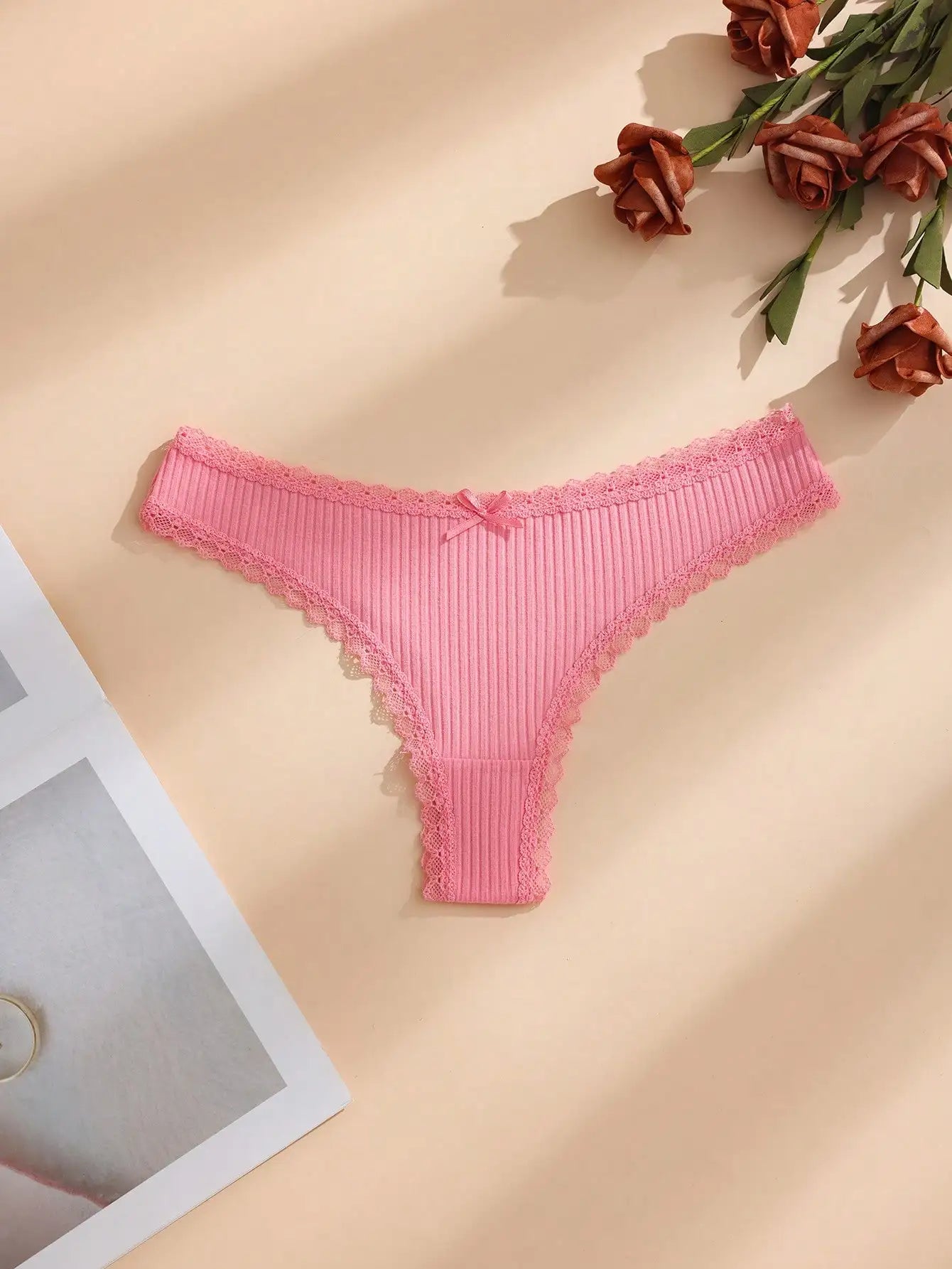 Random color 8-piece set of women's solid thin lace-trimmed thong panties, with cute little bows.